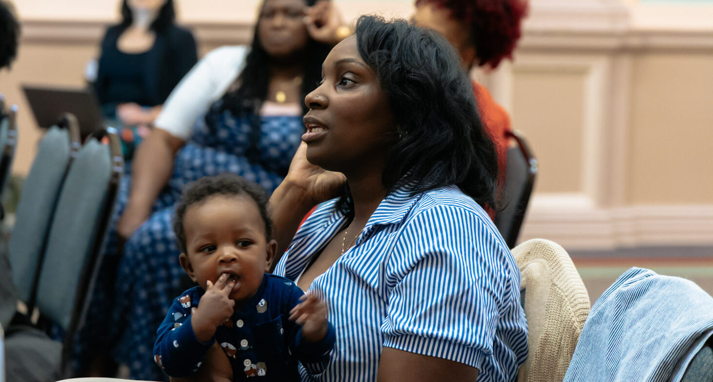 Baby and parent in the audience at the Healthy Start Summit